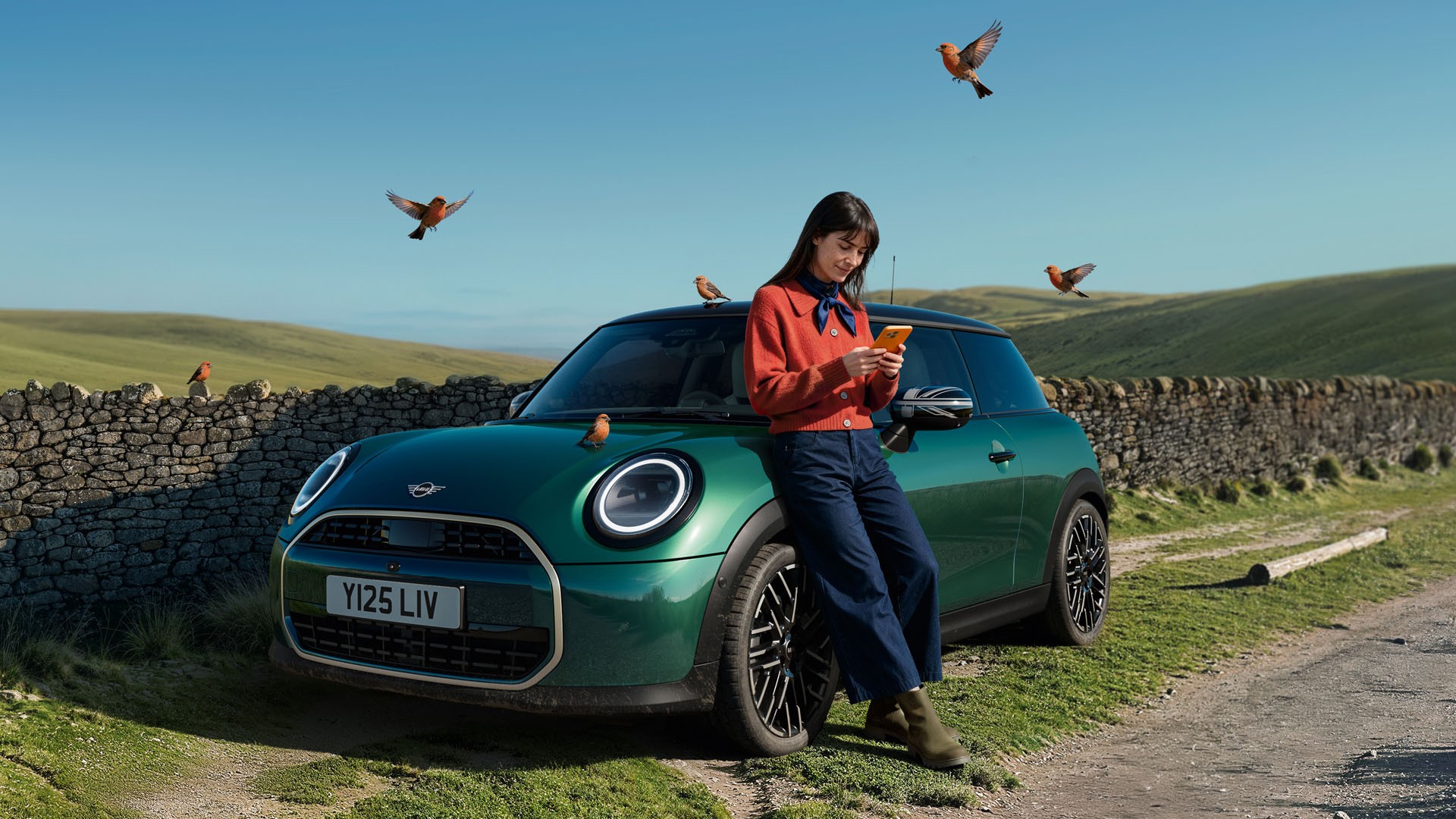 A woman charging her MINI